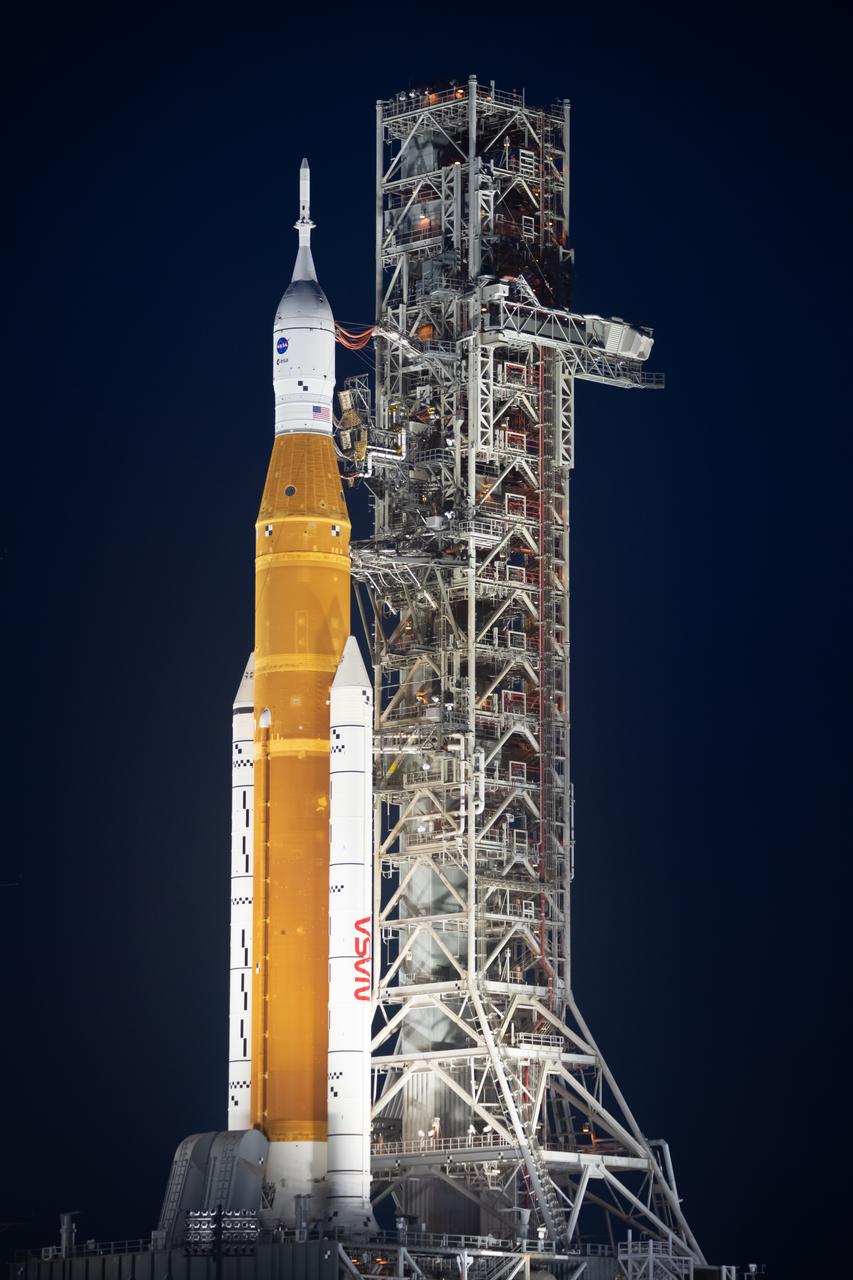 NASA’s Space Launch System (SLS) rocket with the Orion spacecraft aboard is seen atop the mobile launcher at Launch 39B at NASA’s Kennedy Space Center in Florida. Artemis I mission is the first integrated test of the agency’s deep space exploration systems: the Space Launch System rocket, Orion spacecraft, and supporting ground systems. The mission is the first in a series of increasingly complex missions to the Moon. Launch of the uncrewed flight test is targeted for no earlier than Sept. 3 at 2:17 p.m. ET. With Artemis missions, NASA will land the first woman and first person of color on the Moon, using innovative technologies to explore more of the lunar surface than ever before.